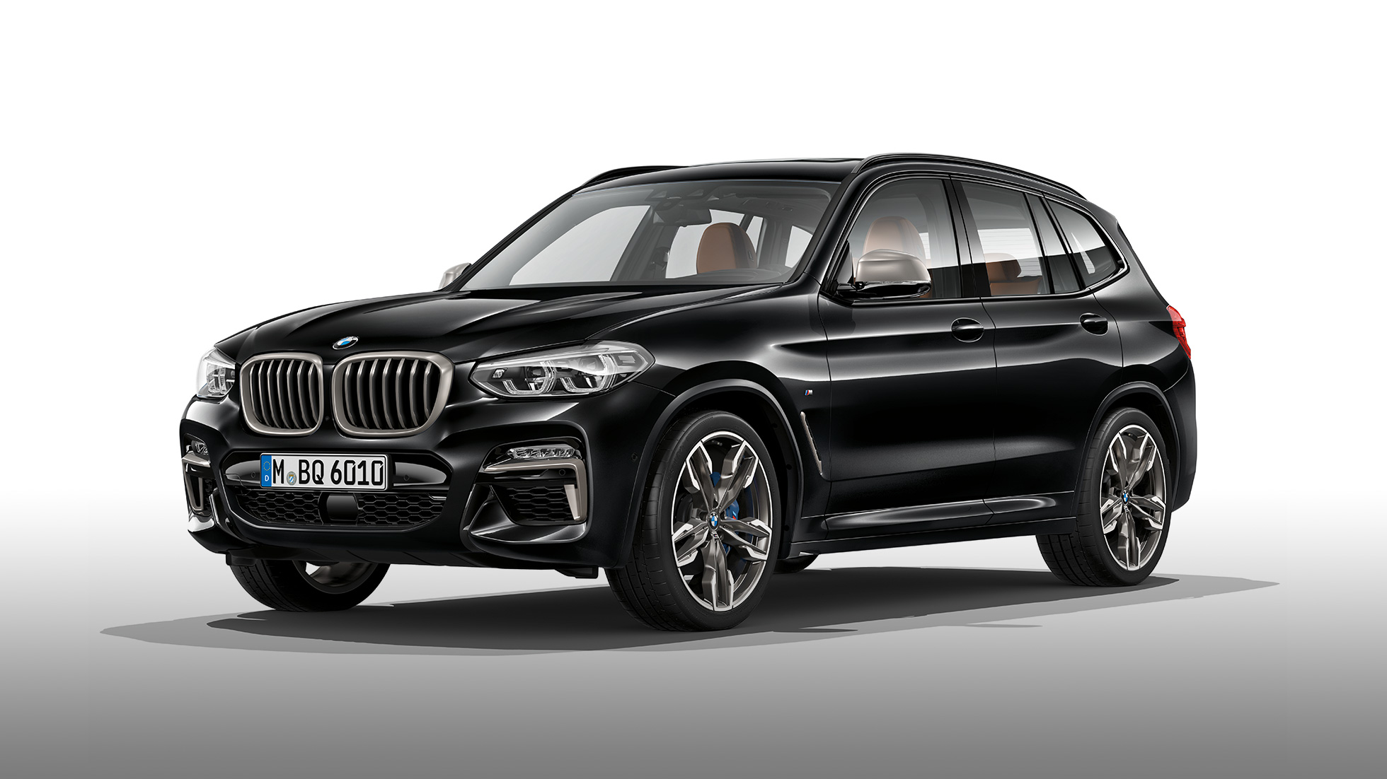 BMW X3 M40i y BMW X3 M40d, vista lateral. BMW X3 M40i y BMW X3 M40d en Black Sapphire metálico, exterior, vista lateral.