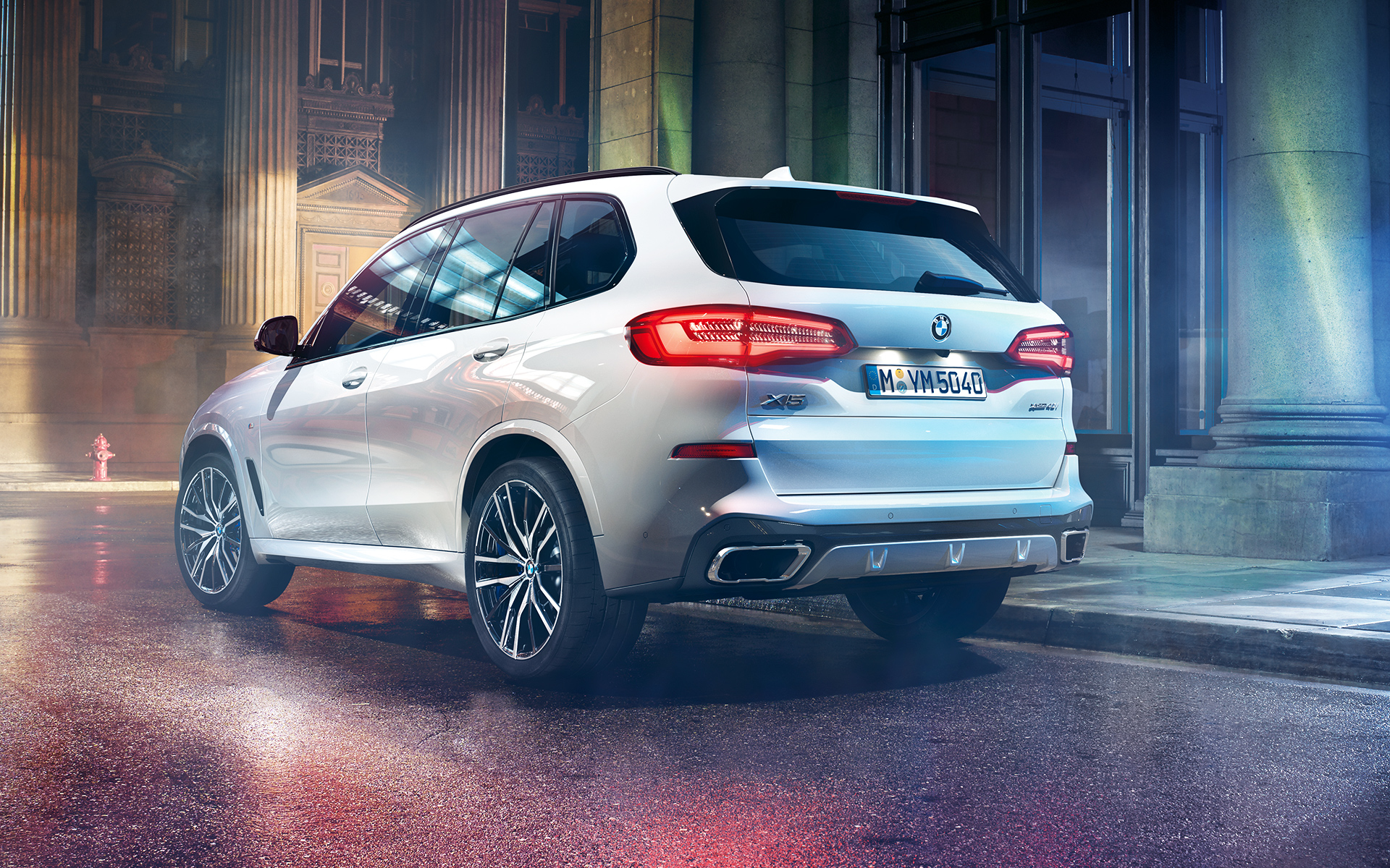 Rear shot of the BMW X5 at night in an urban setting